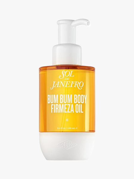 A yellow and white bottle of the Sol de Janeiro Bum Bum Firmeza Body Oil on a light gray background